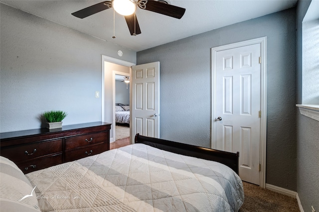 carpeted bedroom with ceiling fan