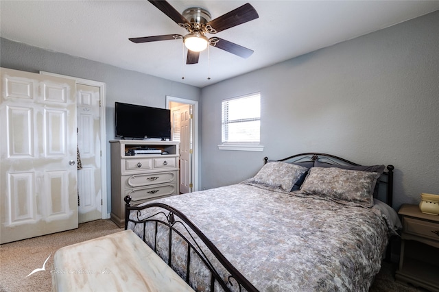 carpeted bedroom featuring ceiling fan