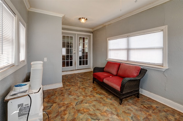 sitting room with plenty of natural light, ornamental molding, french doors, and tile patterned floors