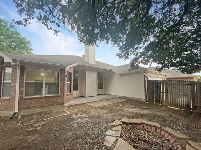 rear view of house with a patio area