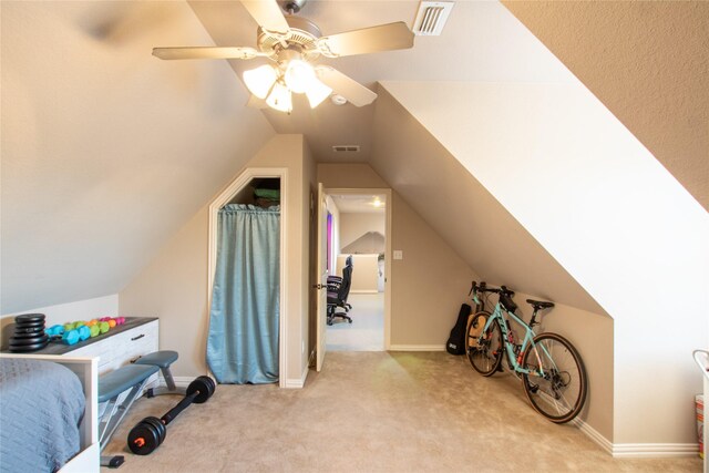 bedroom featuring light carpet, ceiling fan, and lofted ceiling