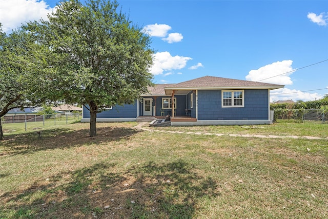 view of front of home featuring a deck and a front lawn