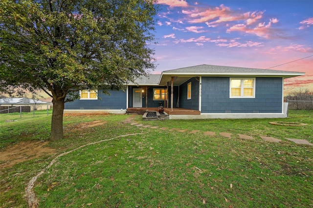 view of front of home featuring a lawn