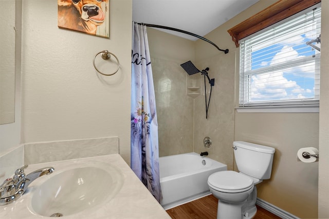 full bathroom with hardwood / wood-style flooring, shower / bath combo with shower curtain, toilet, and vanity