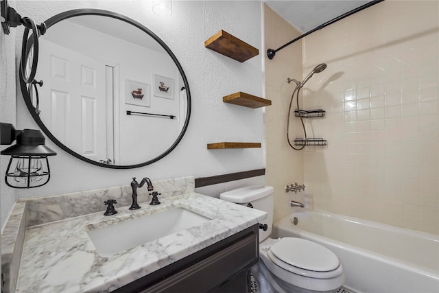 full bathroom with tiled shower / bath combo, toilet, and vanity