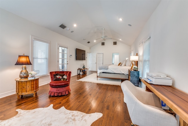 bedroom with lofted ceiling, dark hardwood / wood-style flooring, and ceiling fan