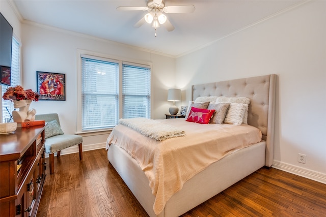 bedroom featuring dark hardwood / wood-style floors, crown molding, and ceiling fan