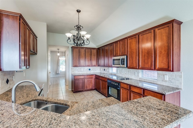 kitchen featuring sink, black appliances, hanging light fixtures, a notable chandelier, and backsplash