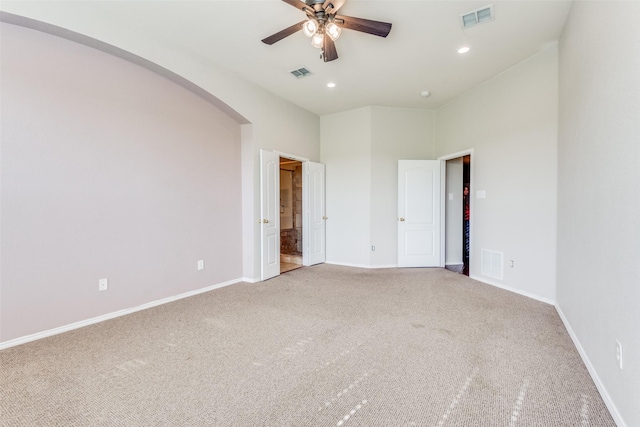 carpeted empty room featuring ceiling fan