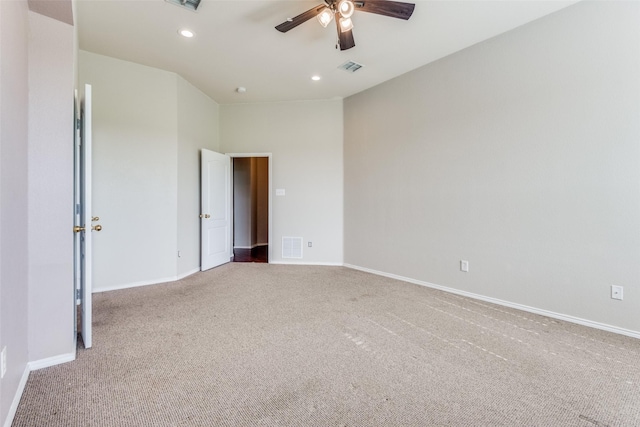 carpeted spare room with ceiling fan