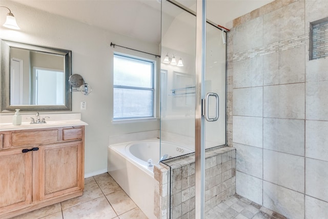 bathroom featuring tile patterned flooring, plus walk in shower, and vanity