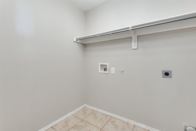 laundry room with electric dryer hookup, washer hookup, light tile patterned flooring, and gas dryer hookup