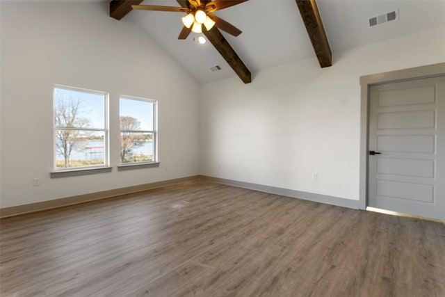 spare room with hardwood / wood-style flooring, ceiling fan, high vaulted ceiling, and beam ceiling