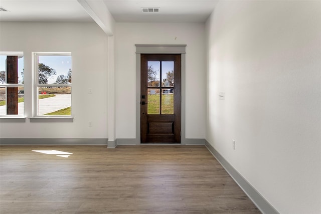 foyer entrance with light wood-type flooring