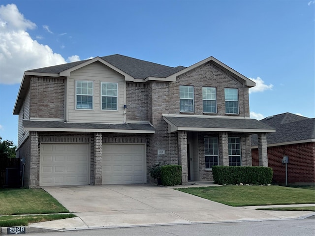 traditional home featuring brick siding, roof with shingles, concrete driveway, an attached garage, and a front lawn