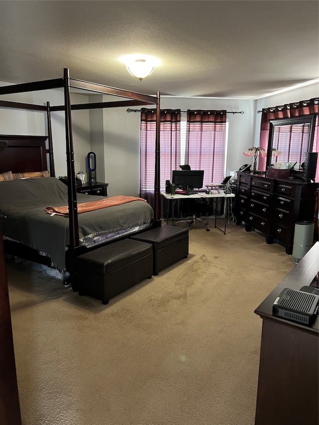 carpeted bedroom with a textured ceiling