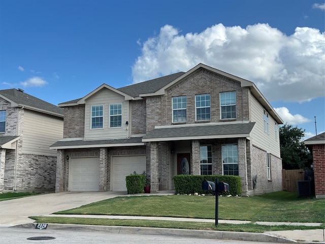 view of front of home with a garage, central air condition unit, and a front lawn