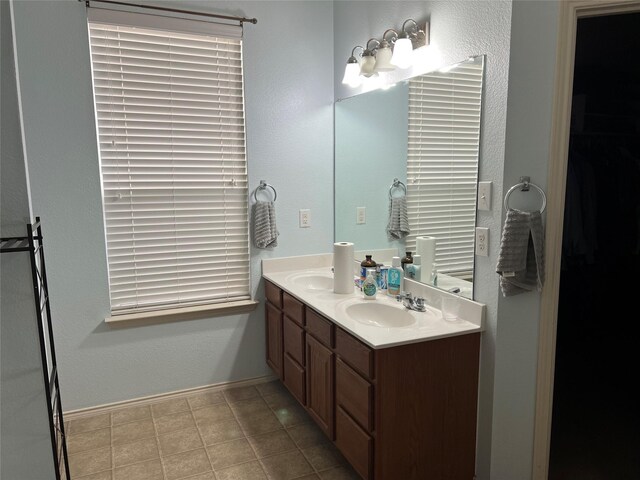 bathroom featuring double vanity and tile patterned floors