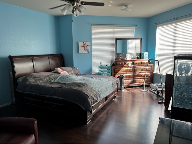 bedroom featuring hardwood / wood-style flooring and ceiling fan