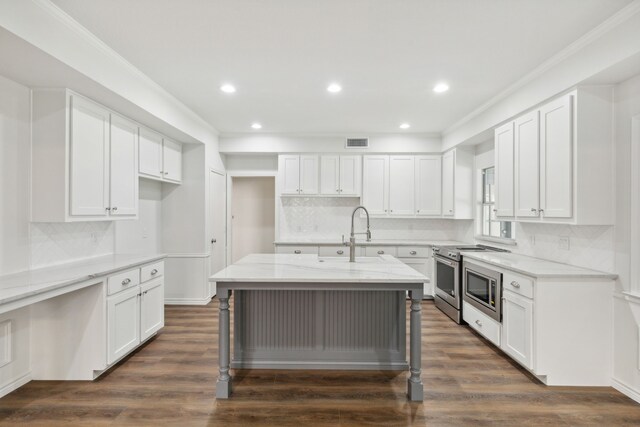 kitchen with white cabinetry, dark hardwood / wood-style floors, and tasteful backsplash