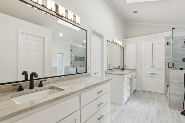 bathroom featuring a shower with door, lofted ceiling, crown molding, and tile patterned flooring