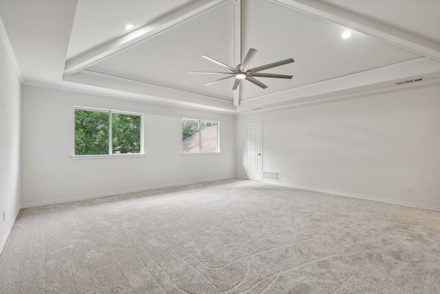 unfurnished room with lofted ceiling with beams, carpet floors, and ceiling fan