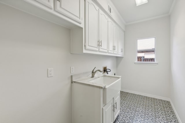 laundry room with crown molding, sink, cabinets, light tile patterned floors, and washer hookup