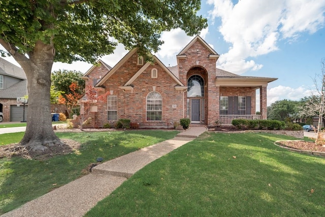 view of front of property featuring covered porch and a front lawn