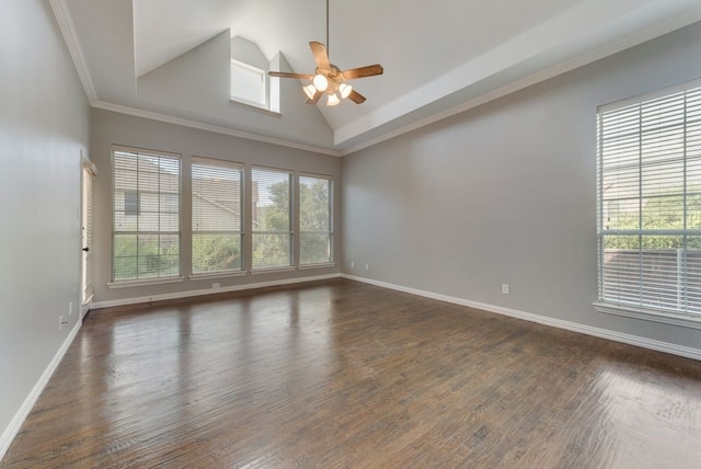 empty room featuring ceiling fan, lofted ceiling, dark hardwood / wood-style flooring, and ornamental molding