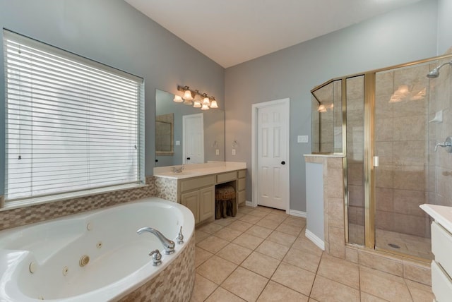 bathroom featuring vanity, tile patterned flooring, and shower with separate bathtub