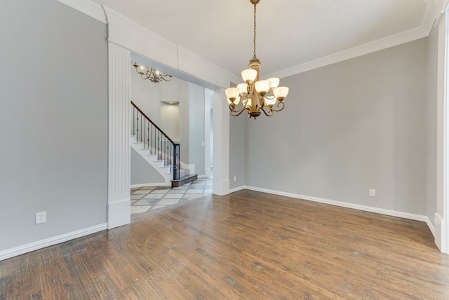 unfurnished room with crown molding, hardwood / wood-style flooring, and a chandelier