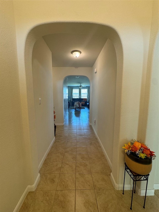 corridor with light tile patterned flooring