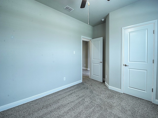 unfurnished bedroom featuring ceiling fan and carpet flooring