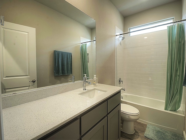 full bathroom featuring vanity, hardwood / wood-style flooring, toilet, and shower / tub combo with curtain