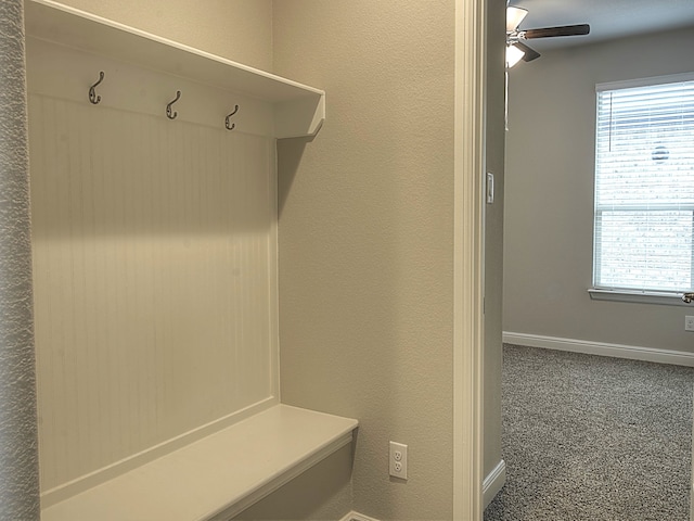 mudroom with carpet, ceiling fan, and a healthy amount of sunlight