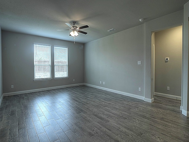 unfurnished room featuring dark hardwood / wood-style flooring and ceiling fan