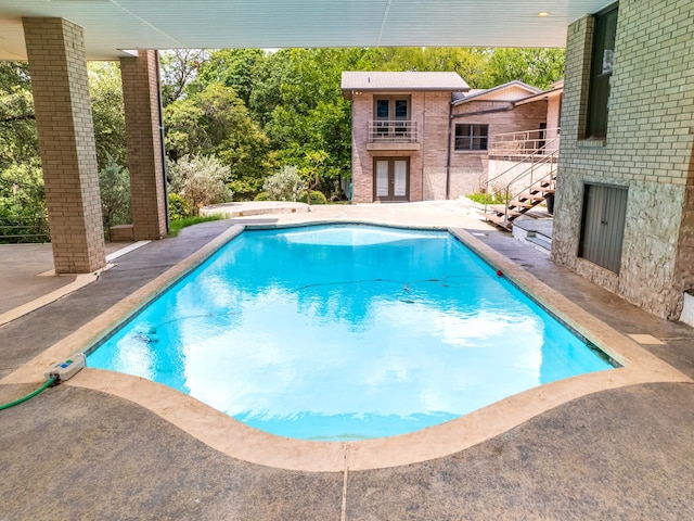 view of pool featuring a patio