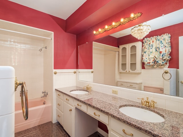 bathroom featuring tiled shower / bath combo, decorative backsplash, and tile walls