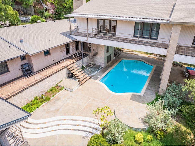 view of pool featuring a patio area