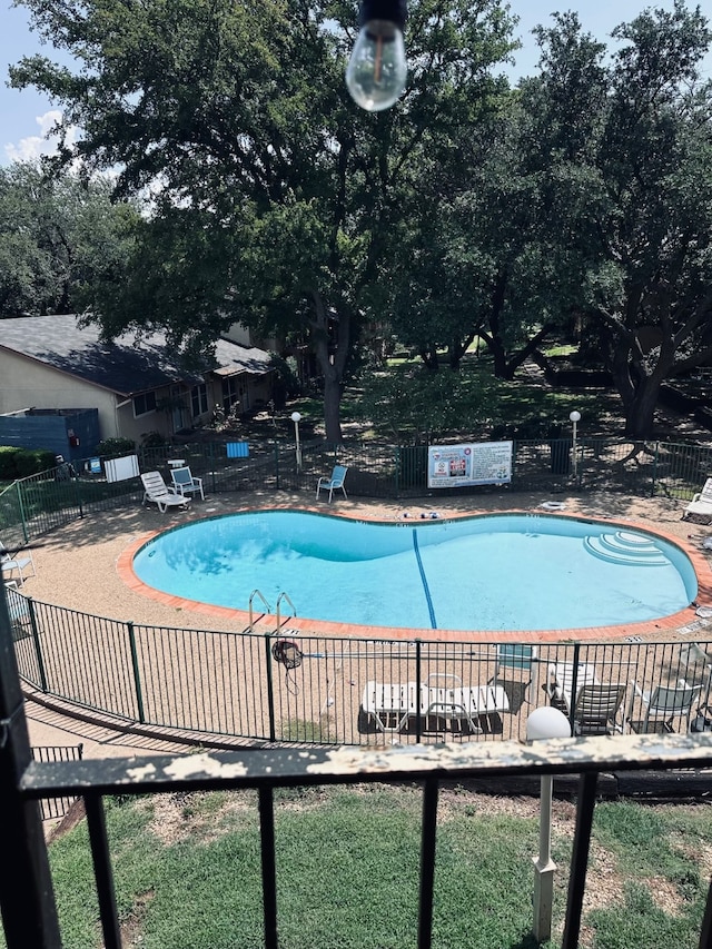 view of swimming pool featuring a patio area