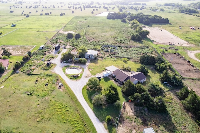 birds eye view of property with a rural view