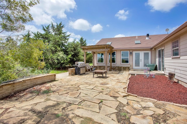 view of patio featuring french doors, area for grilling, and a pergola