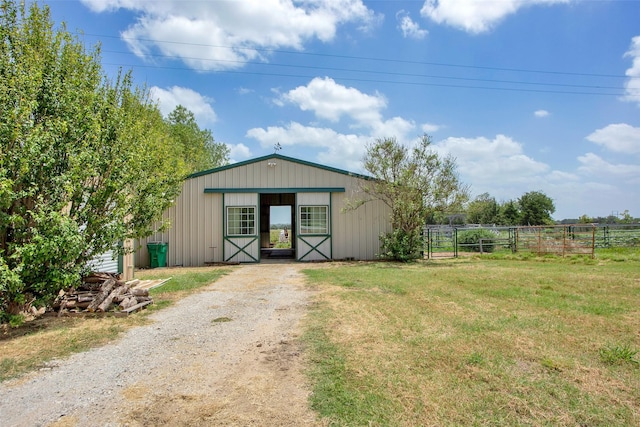 view of outbuilding featuring a yard