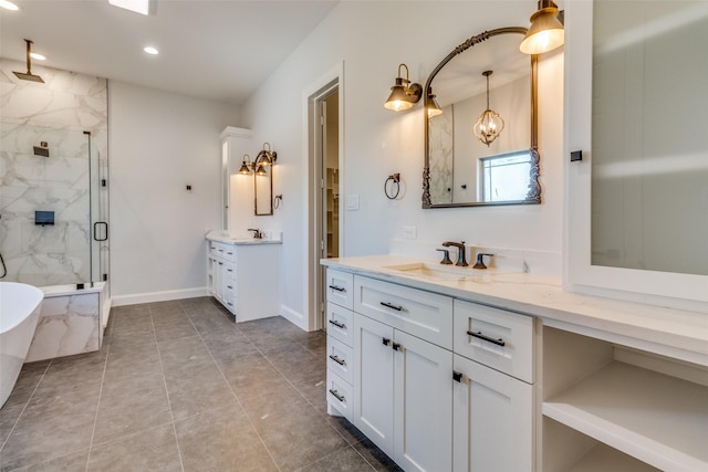 bathroom featuring vanity, a shower with shower door, and tile patterned flooring