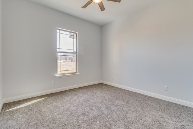 spare room with carpet and ceiling fan