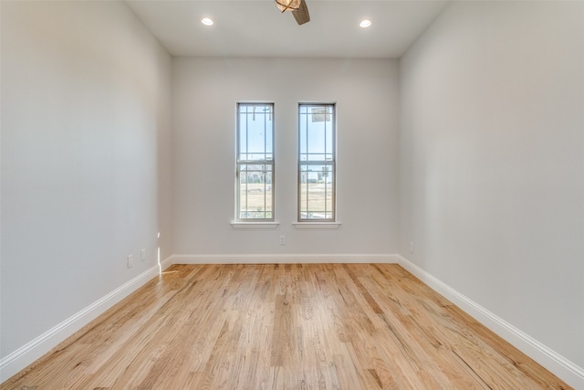 unfurnished dining area with a healthy amount of sunlight, light hardwood / wood-style floors, and an inviting chandelier