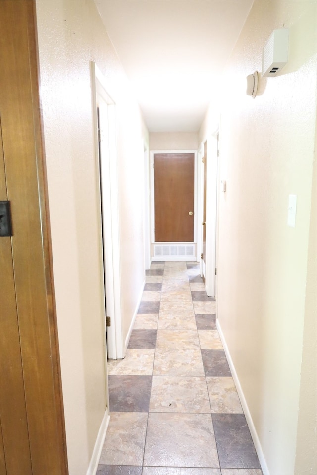 hallway with light tile patterned flooring