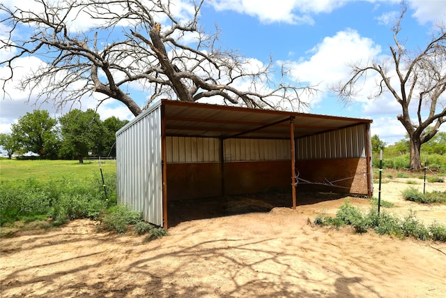 view of outbuilding with a carport