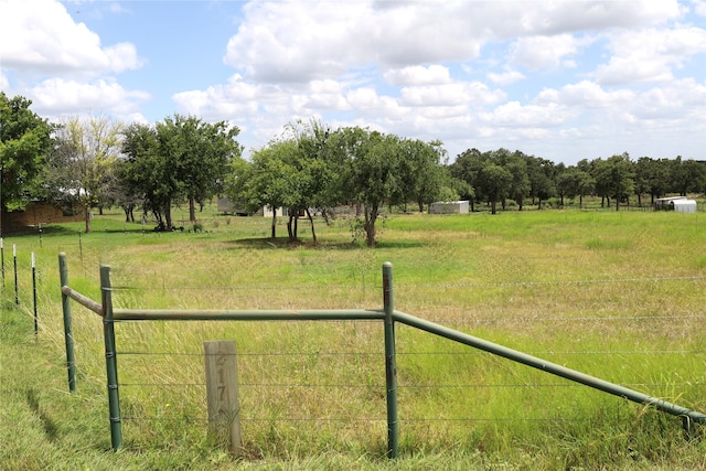 view of yard with a rural view