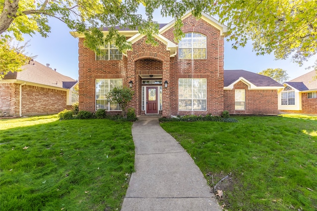 view of property with a front lawn